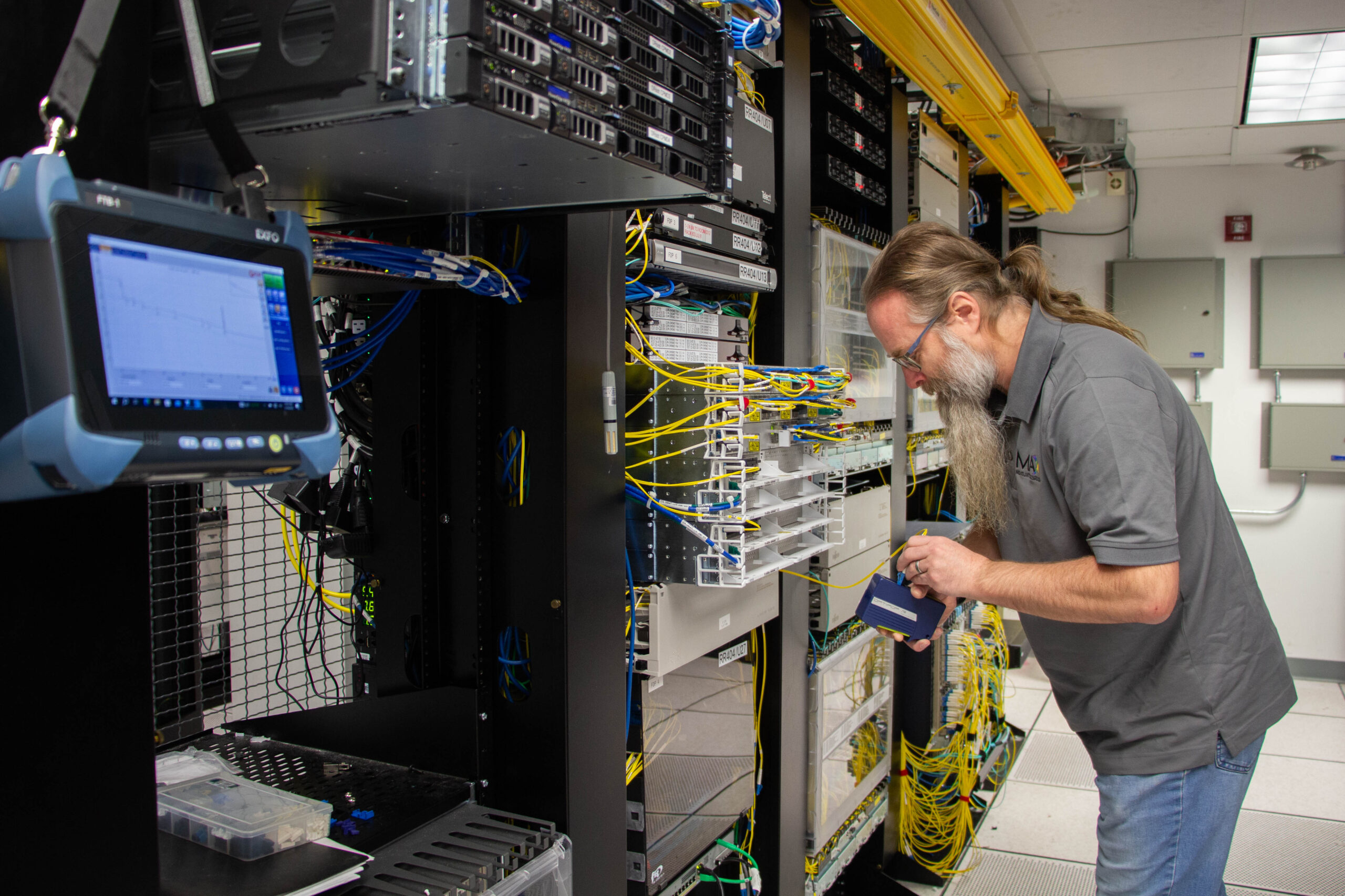 Dave in Lab MAX Website Photo Diller in datacenter lab
